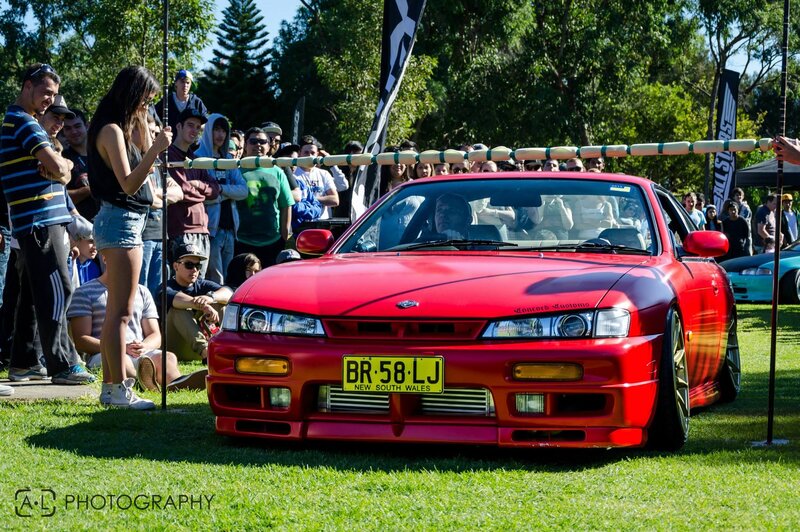 Red car at outdoor show