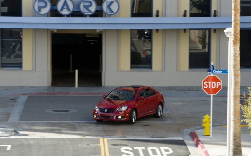 Red car at parking entrance