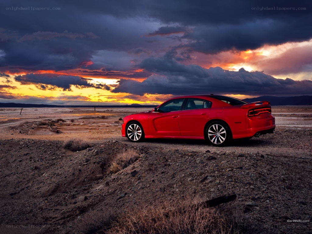 Red car at sunset in desert