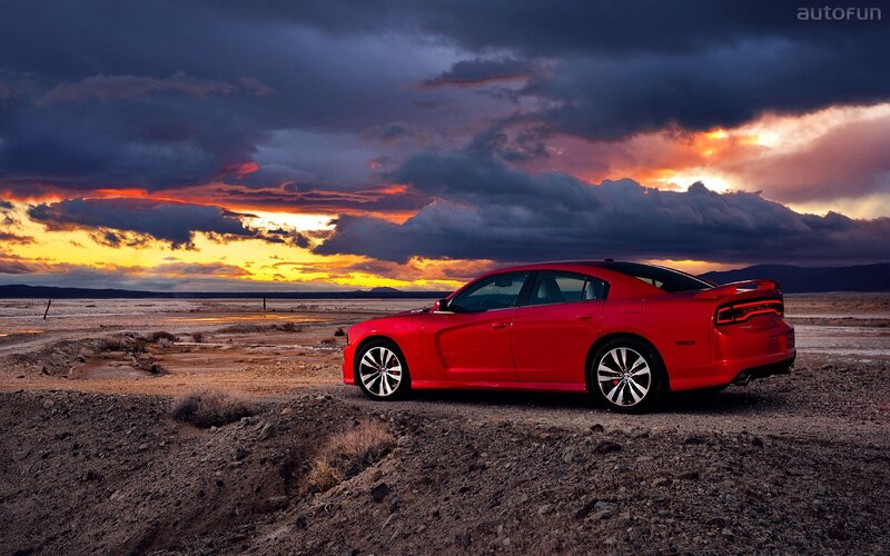 Red car at sunset in desert