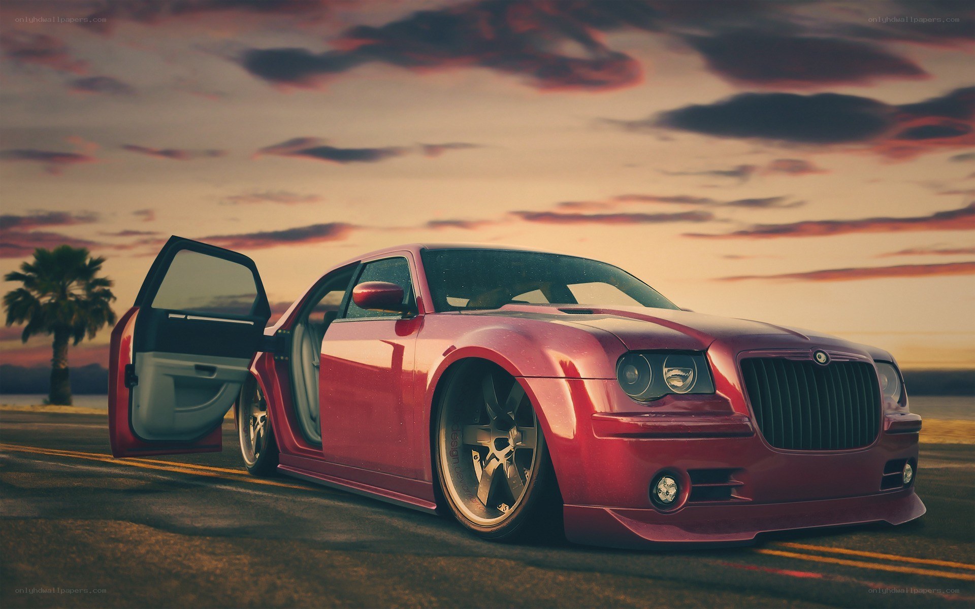 Red car at sunset on road
