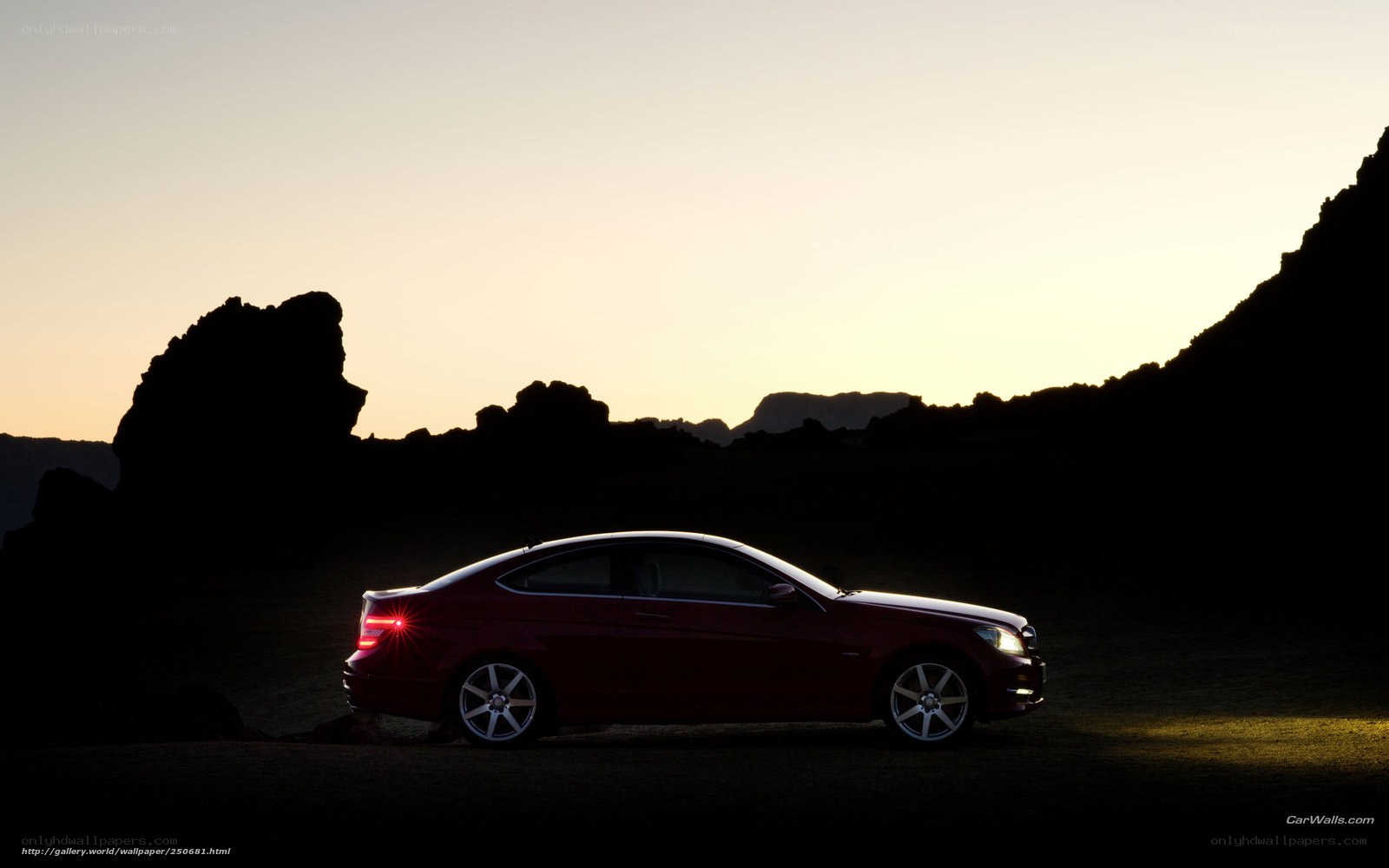 Red car at sunset silhouette