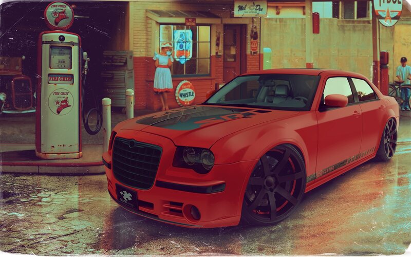 Red car at vintage gas station