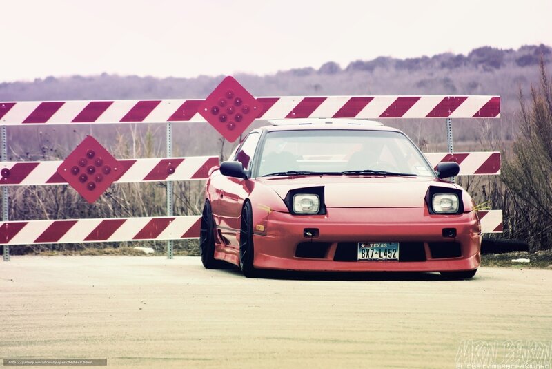 red car behind barrier