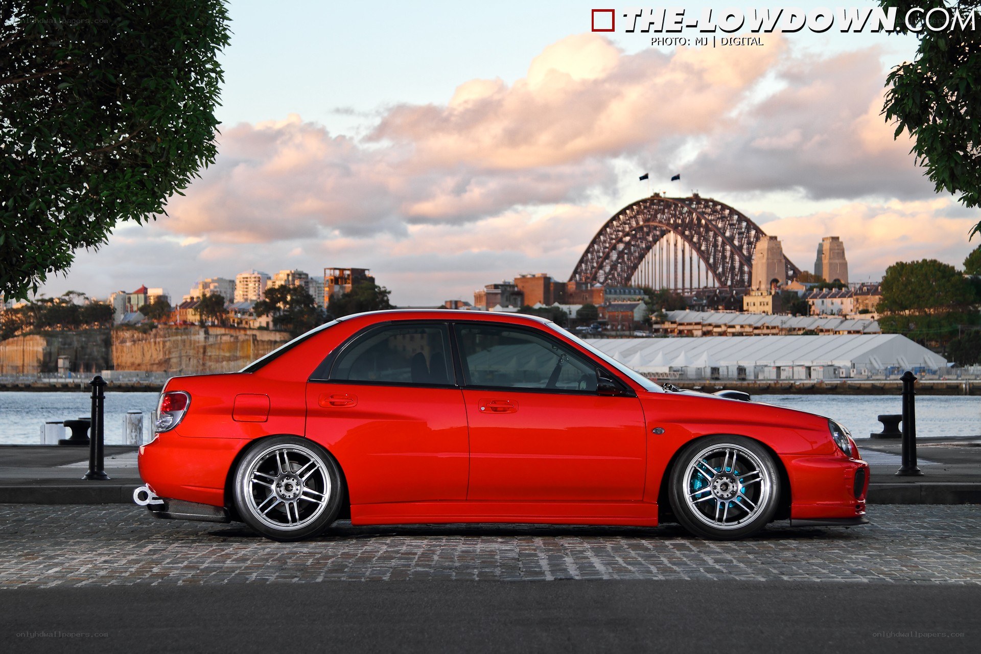 Red car by Sydney Harbour