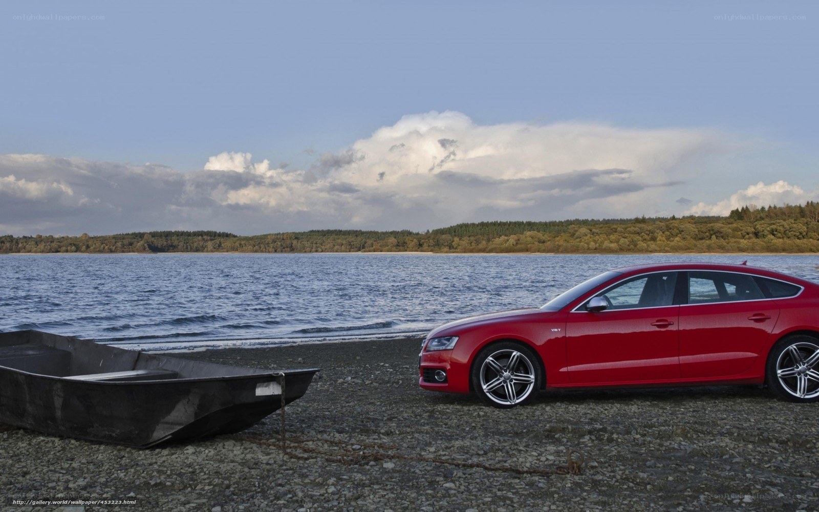 Red car by the lake