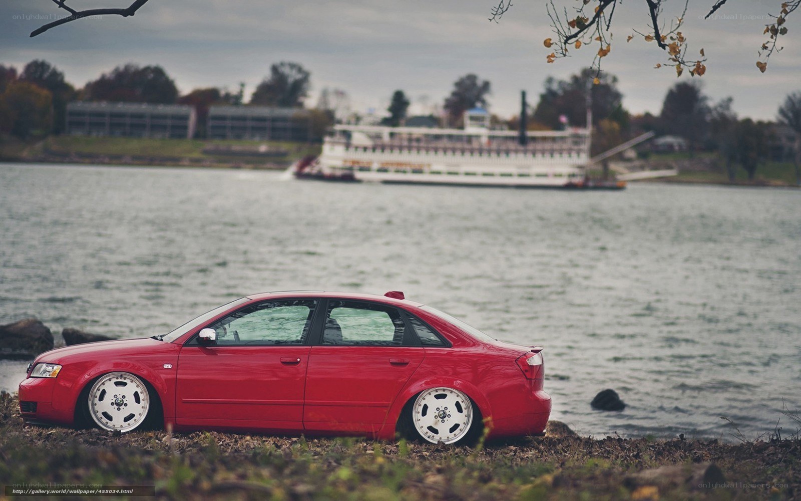 Red car by the river