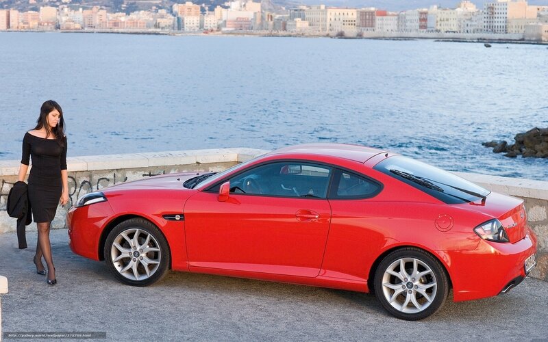 Red car by the sea