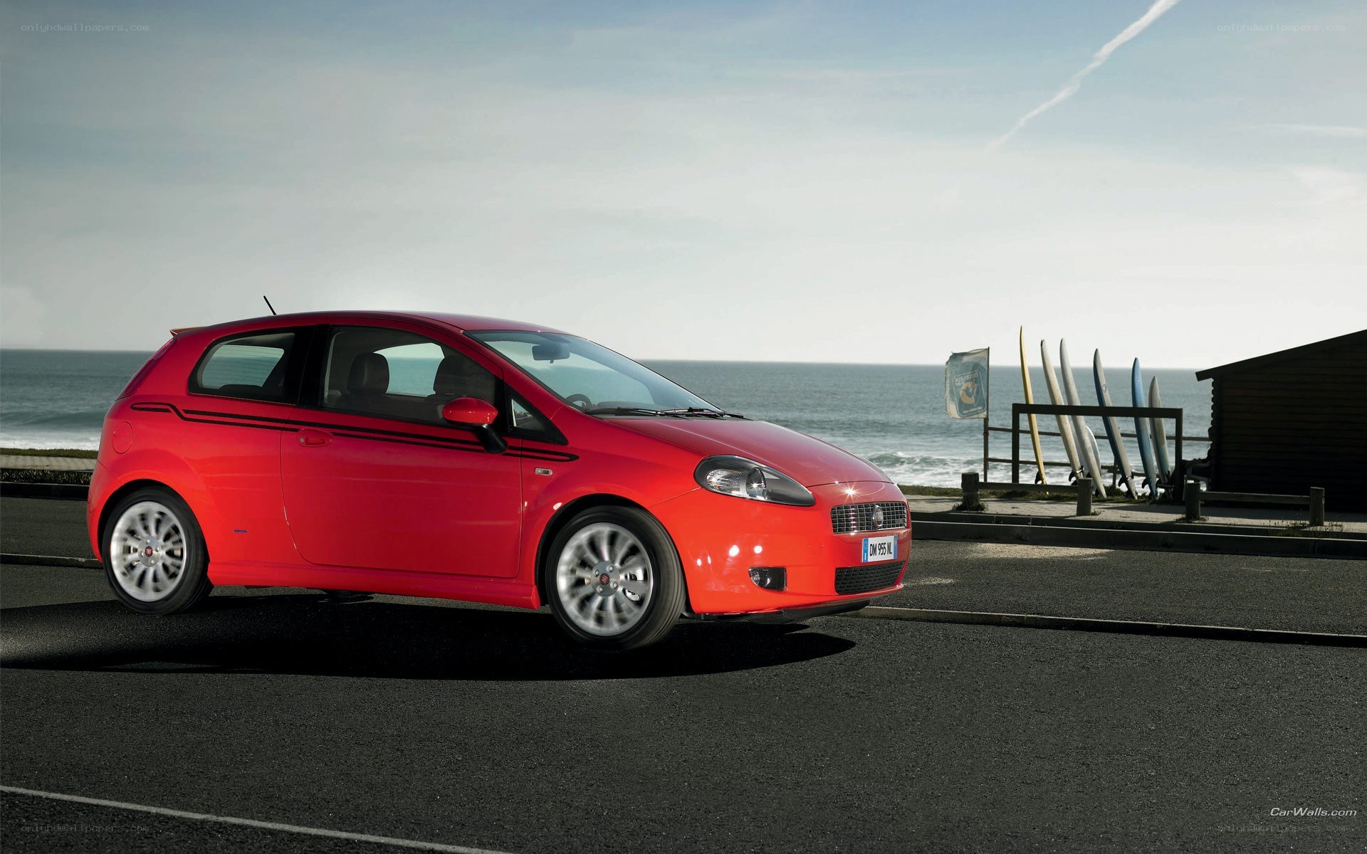 Red car by the sea