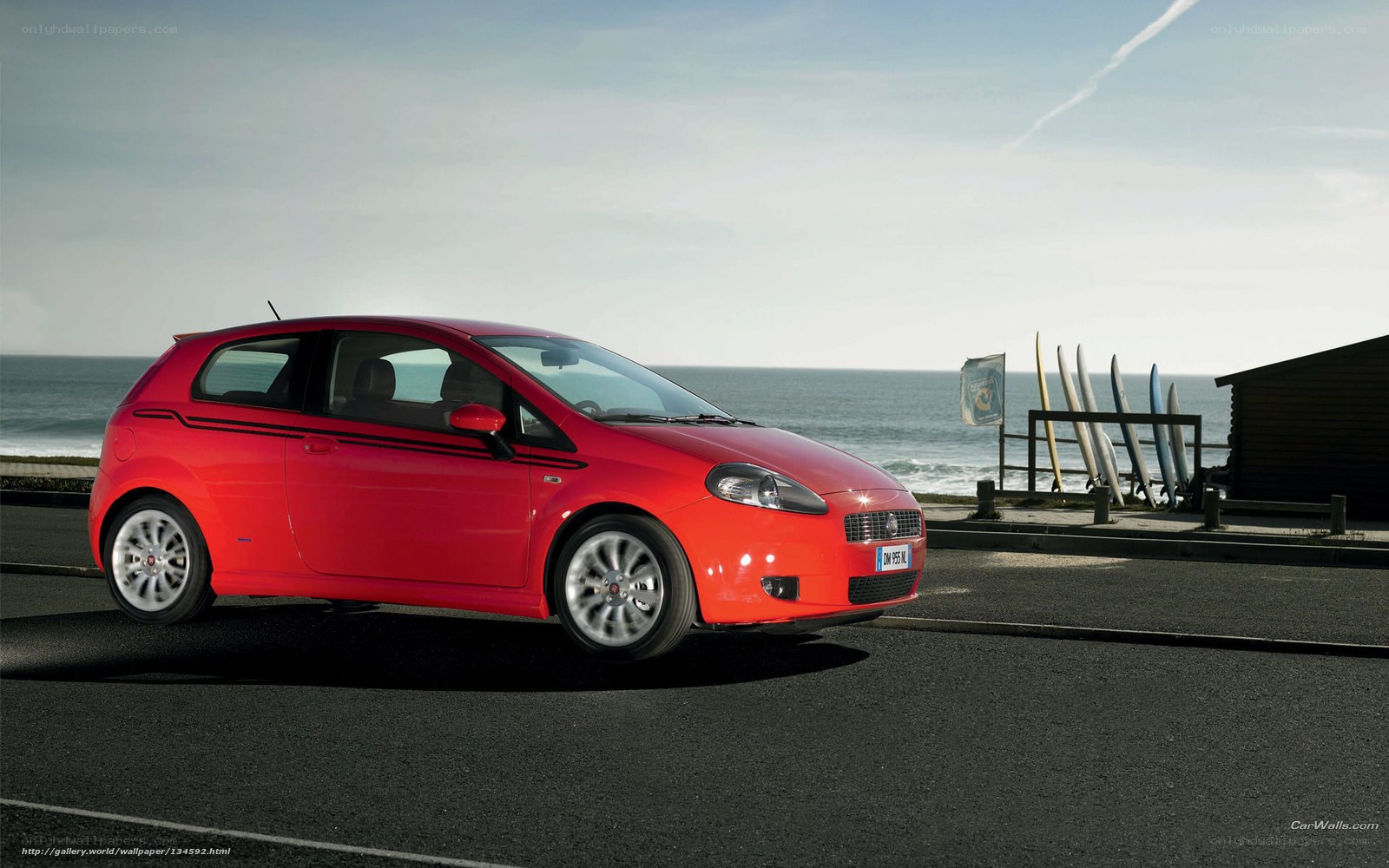 Red car by the sea