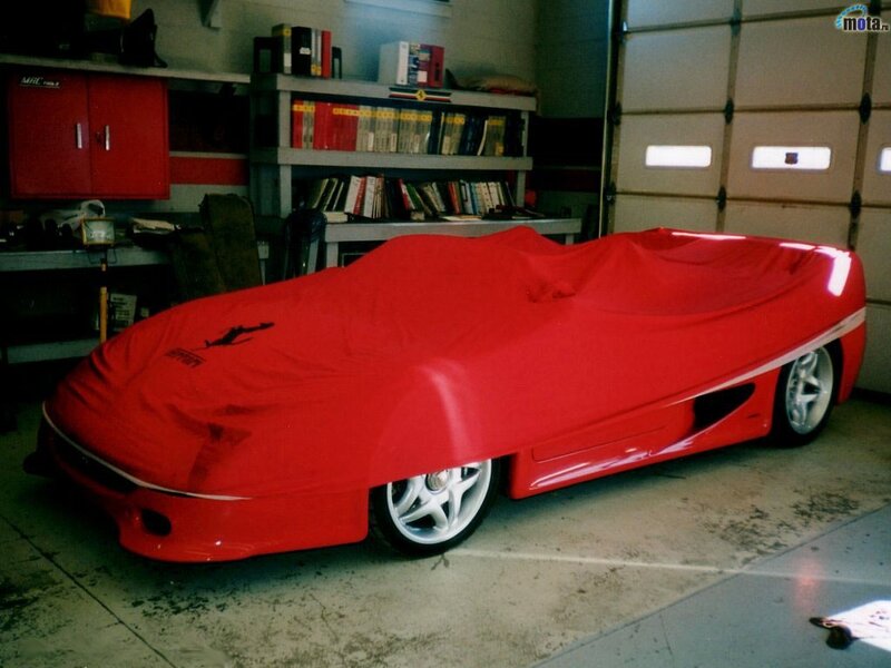 Red car cover in garage