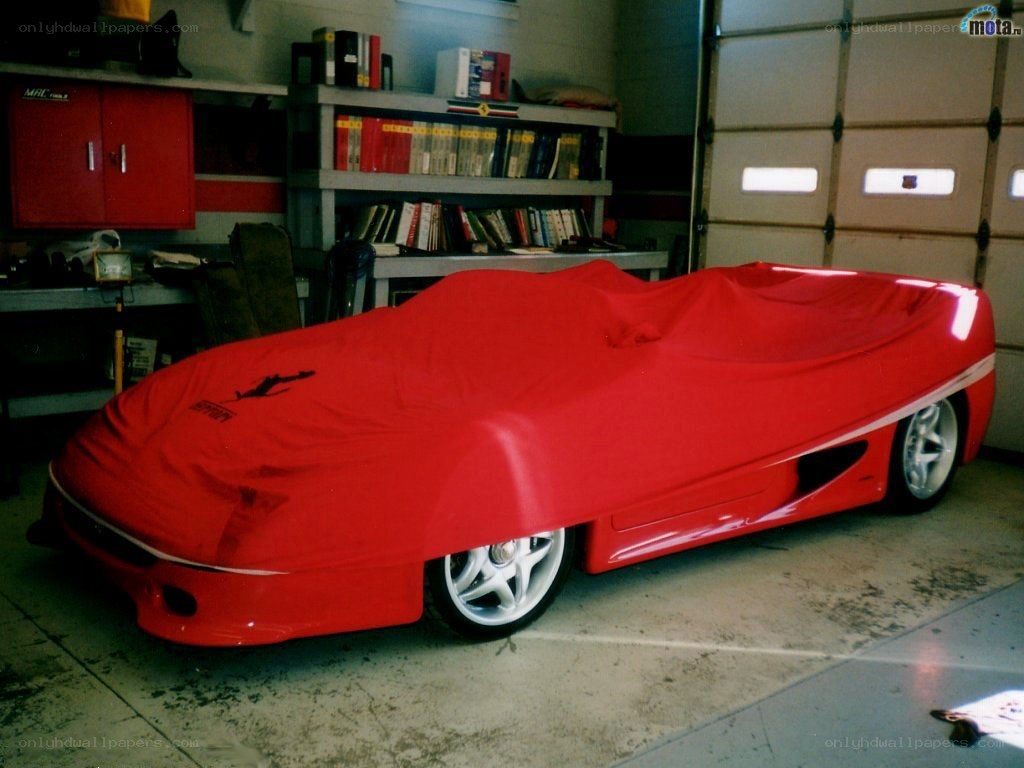 Red car cover in garage