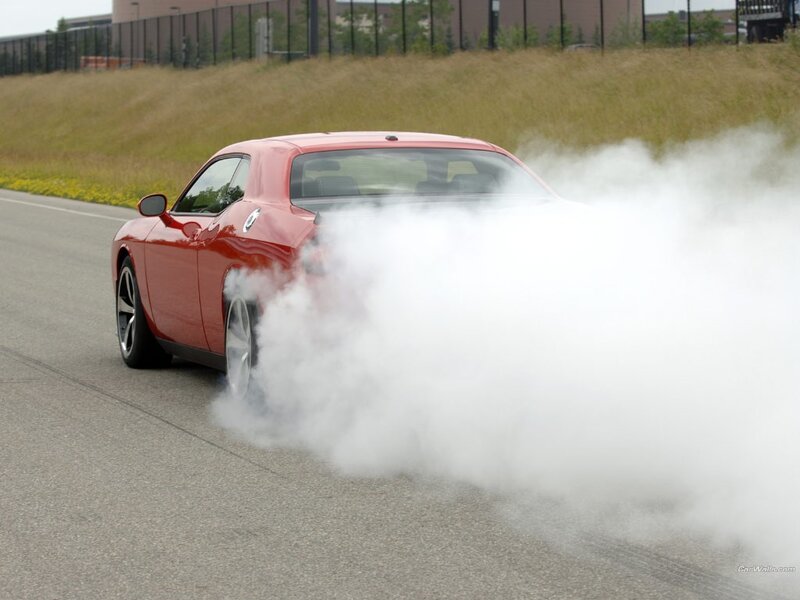 Red car doing burnout