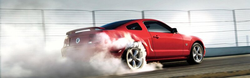 red car doing burnout