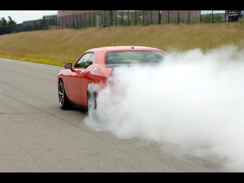 Red car doing burnout