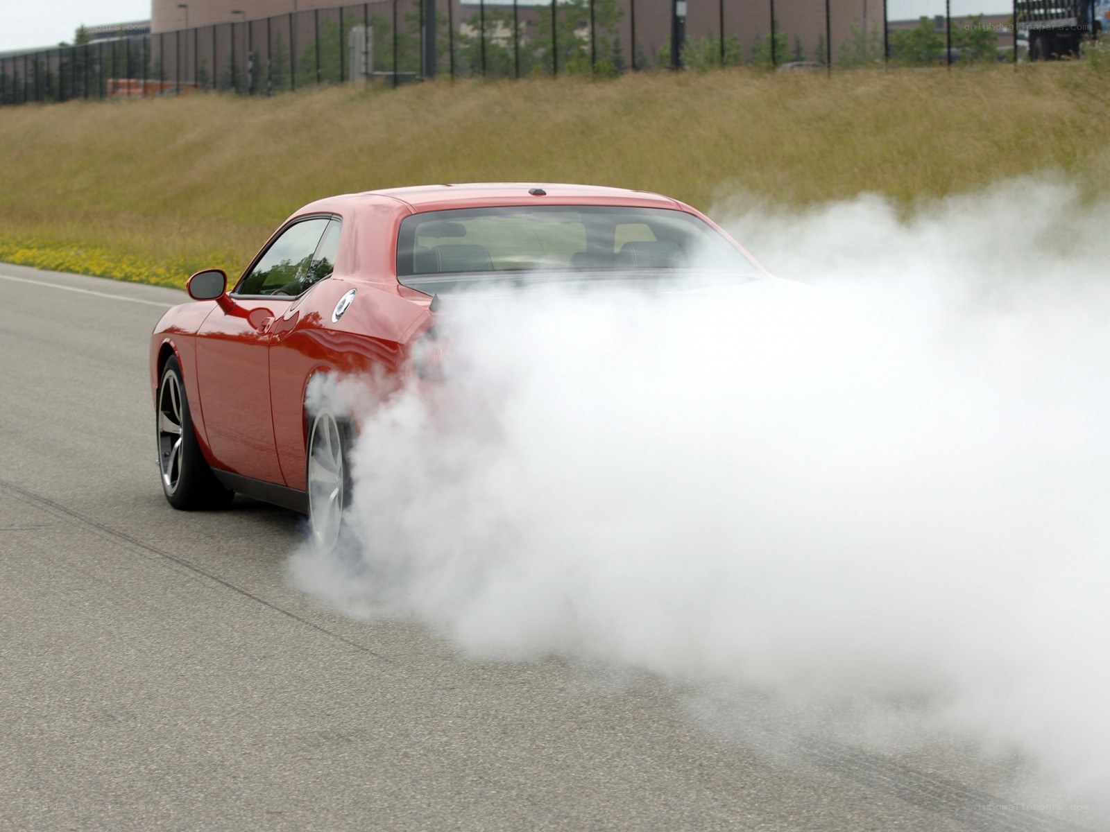 Red car doing burnout