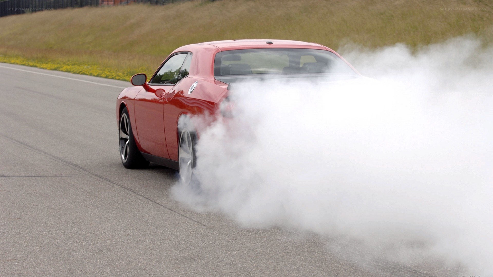 Red car doing burnout