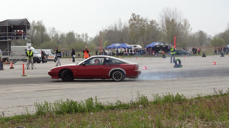 Red car drifting at event