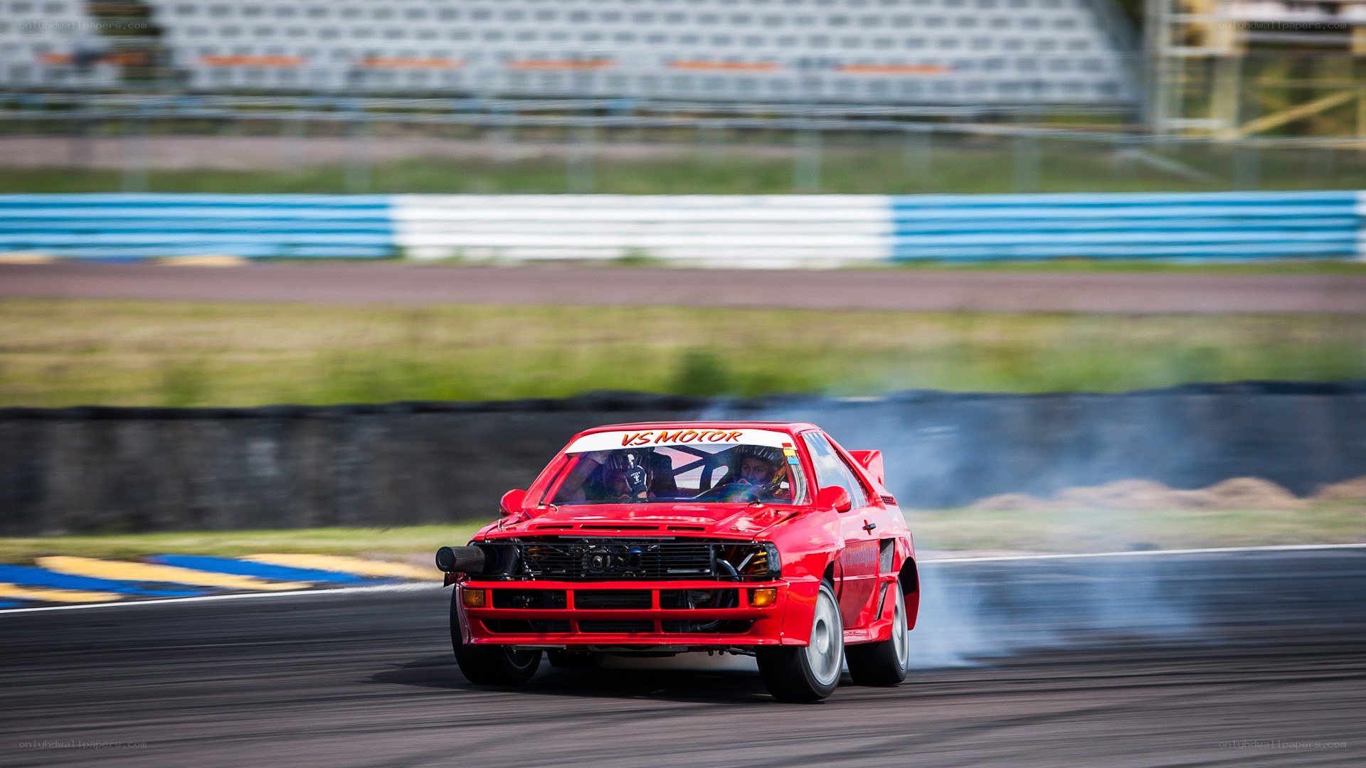 Red car drifting on track