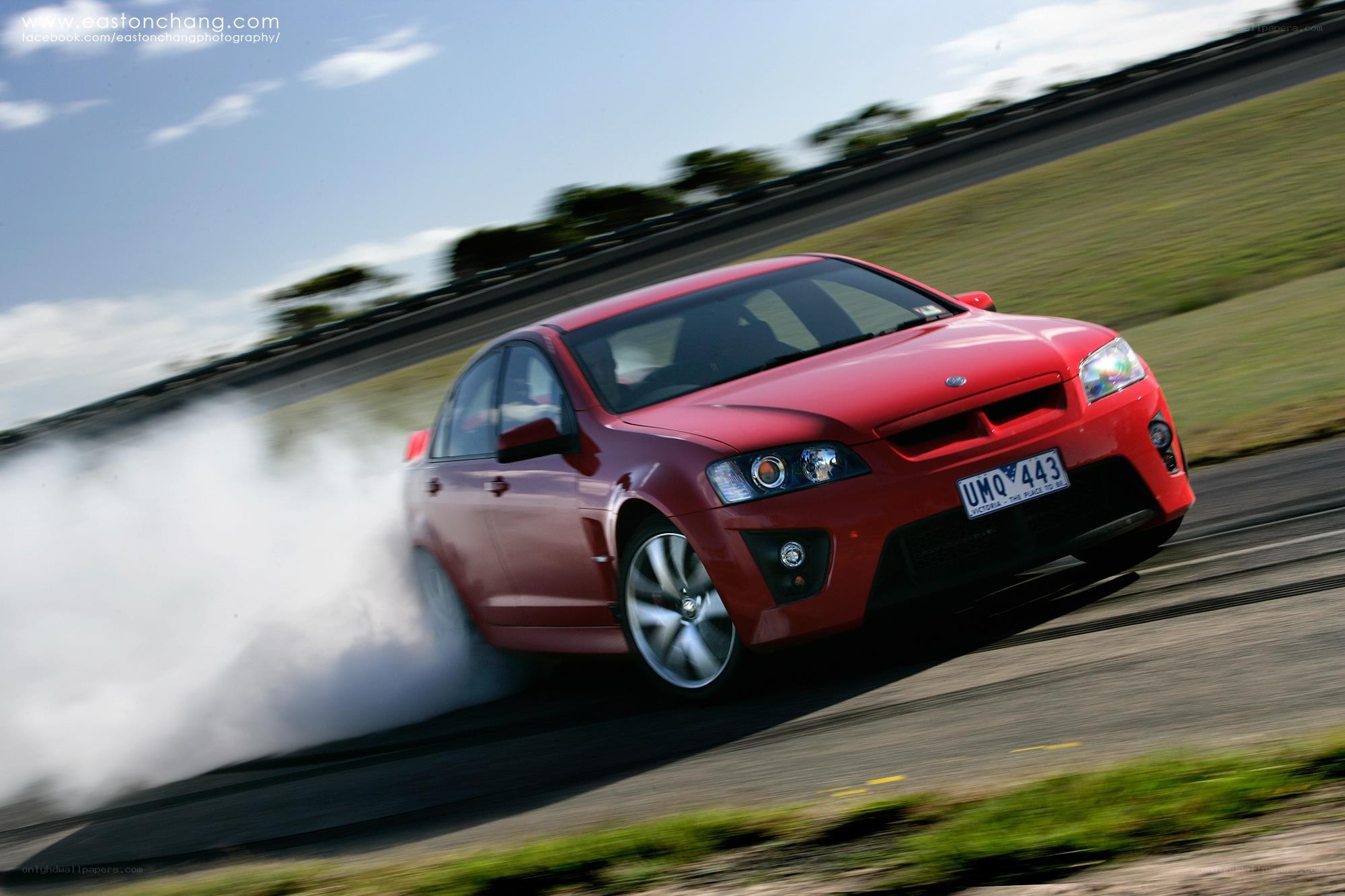 Red car drifting on track