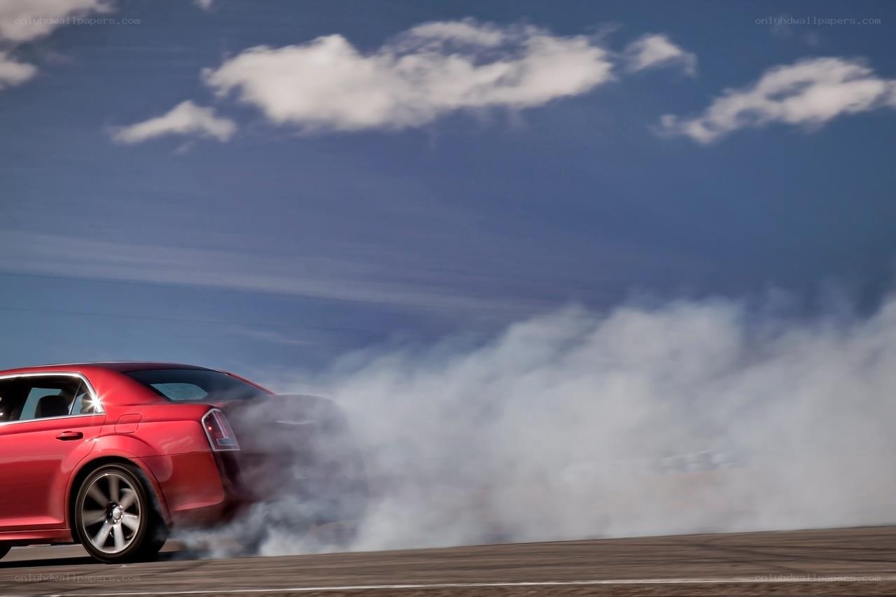 Red car drifting on track