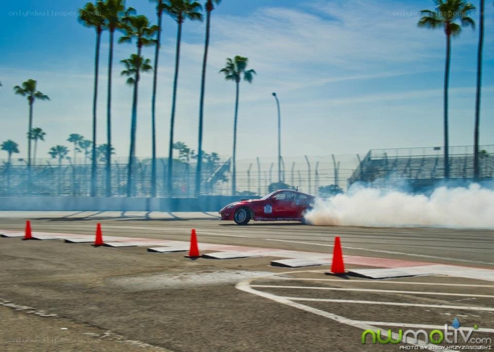 Red car drifting on track