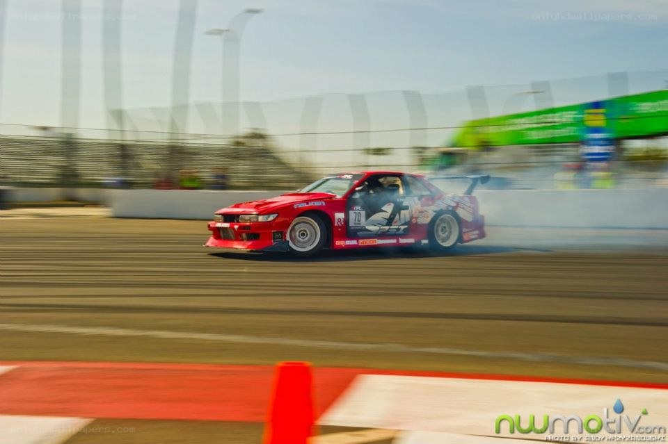 Red car drifting on track
