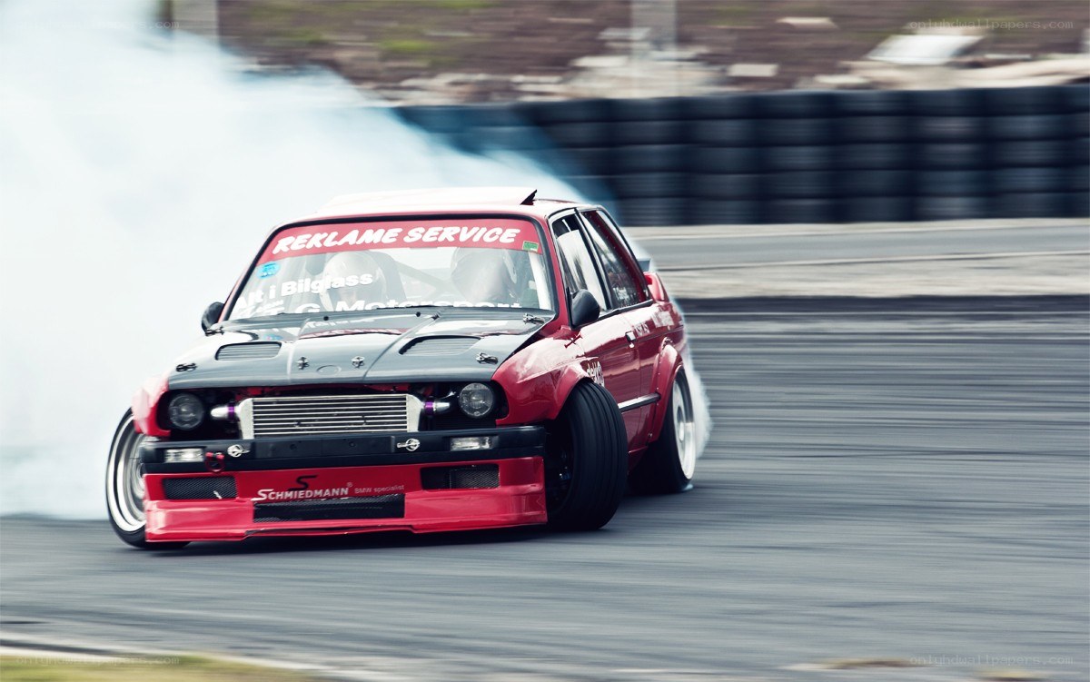 Red car drifting on track