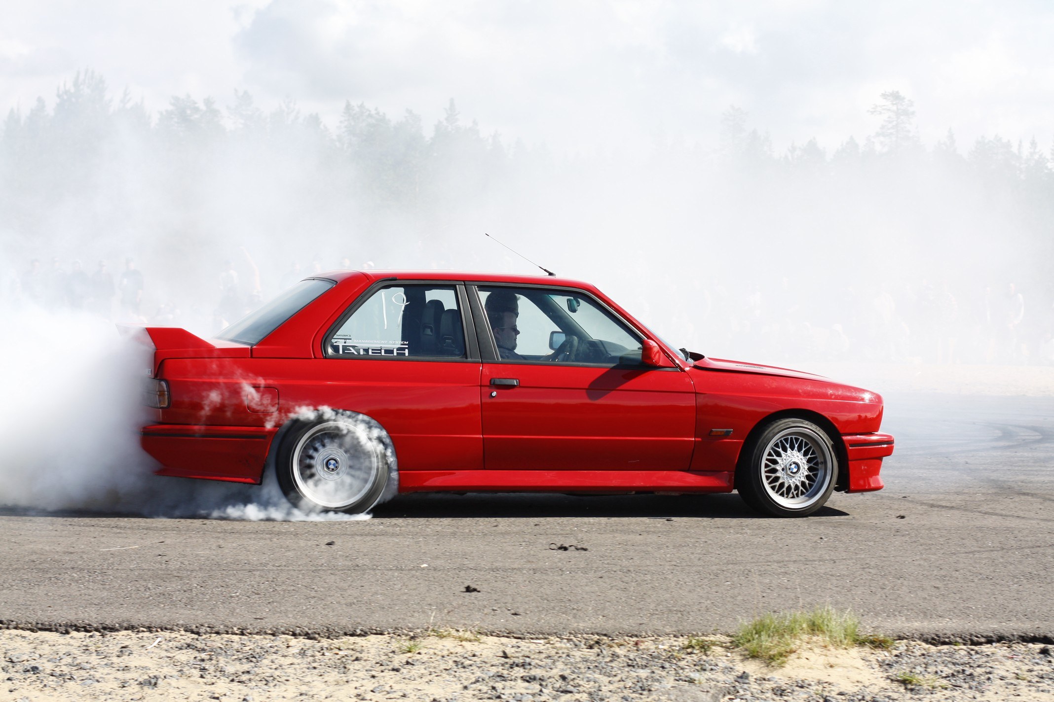 Red car drifting on track