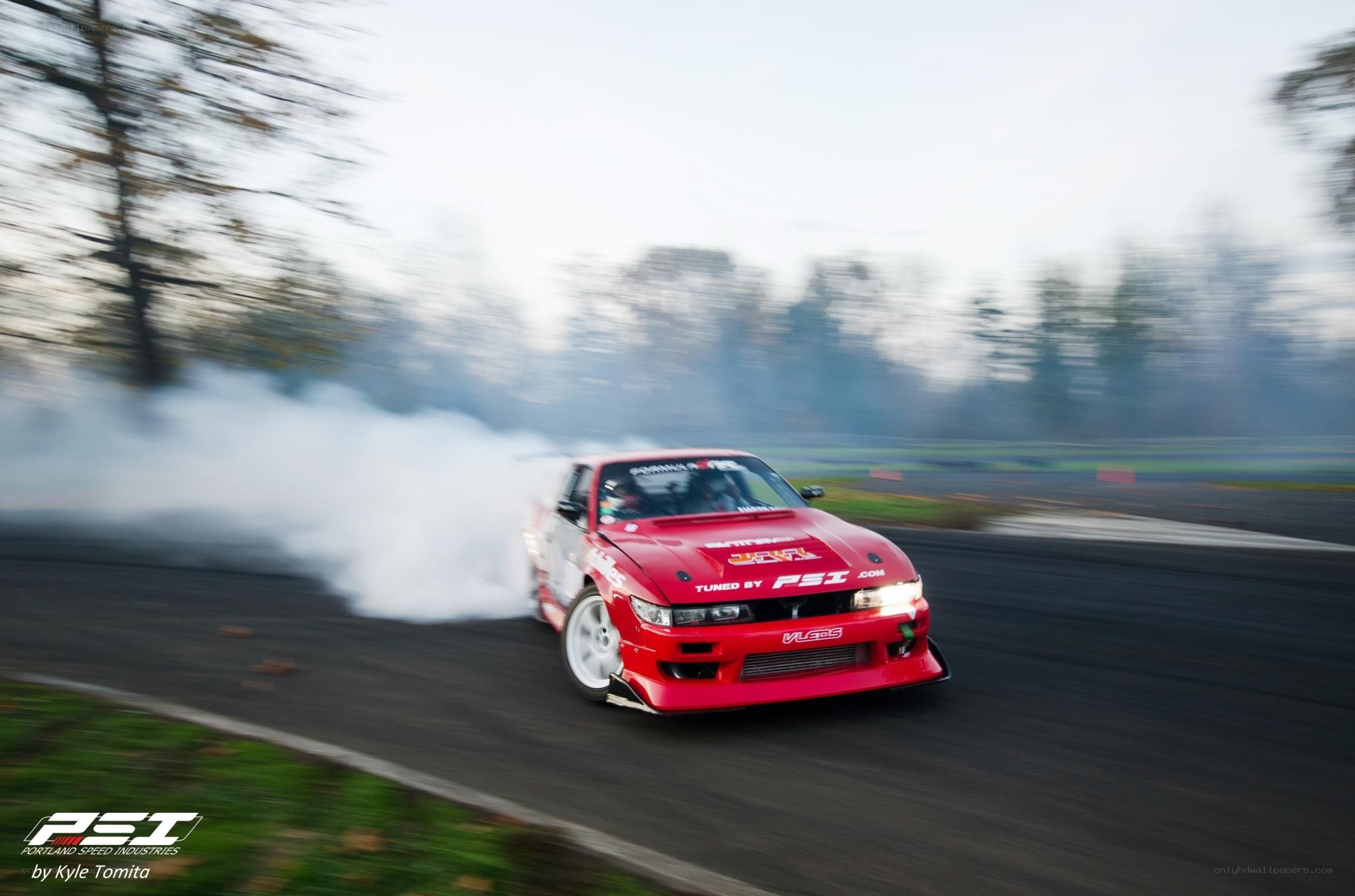 Red car drifting on track