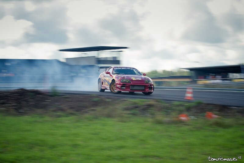 Red car drifting on track