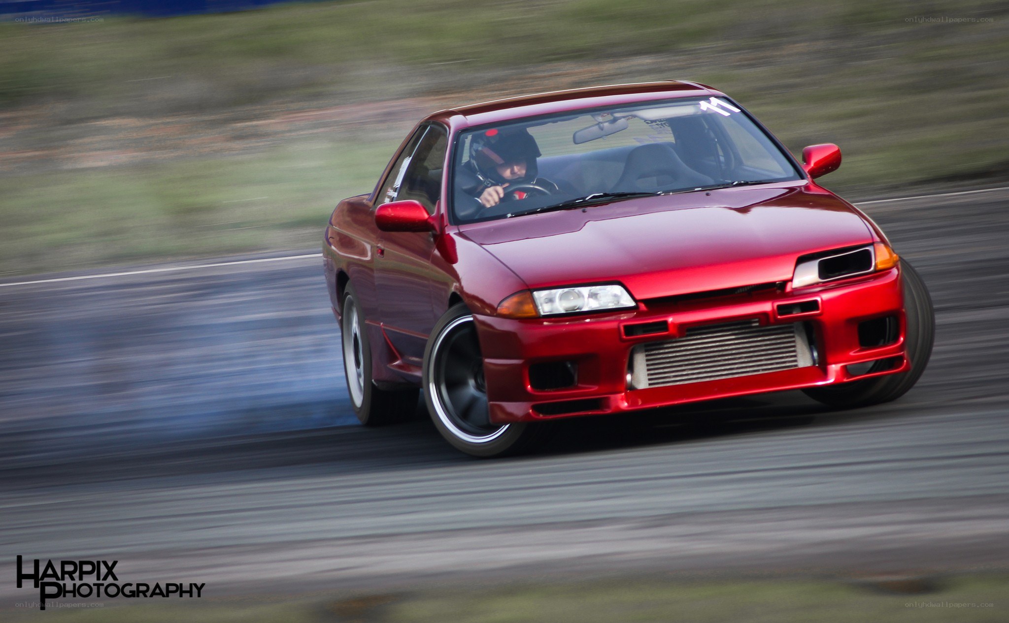 Red car drifting on track