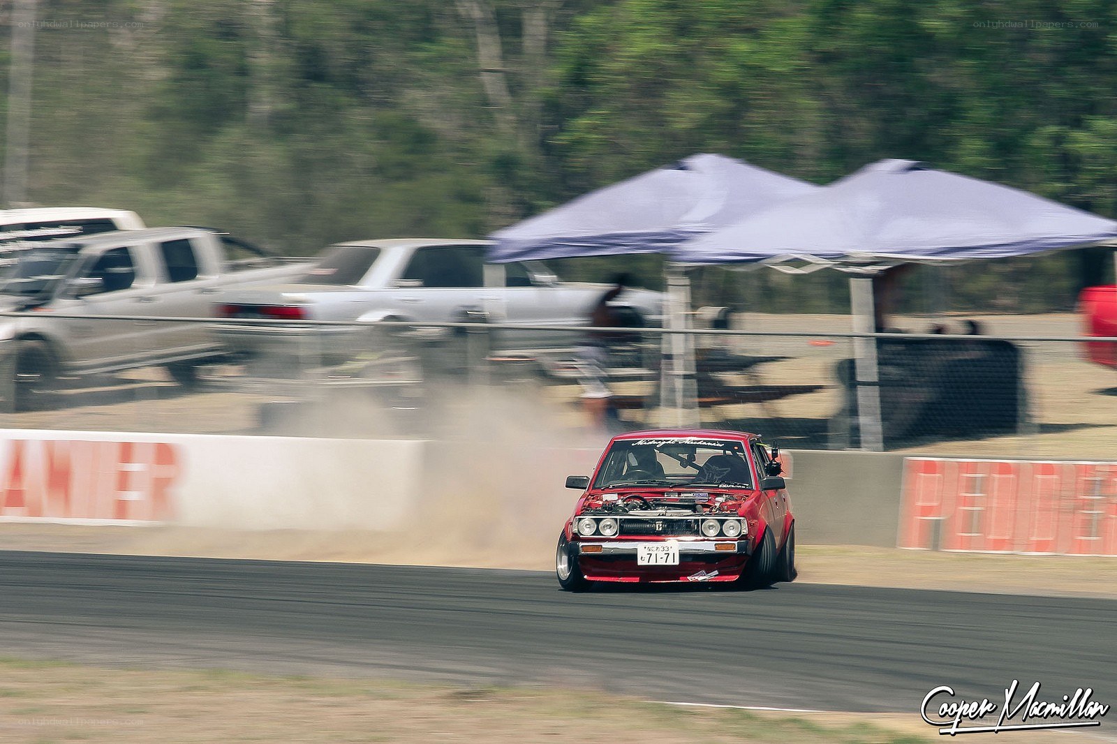 Red car drifting on track