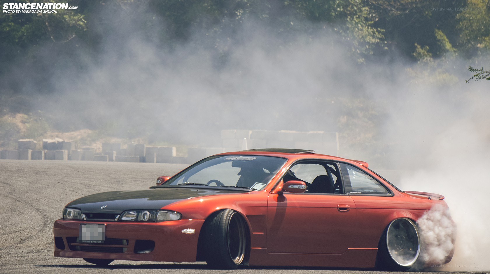 Red car drifting on track