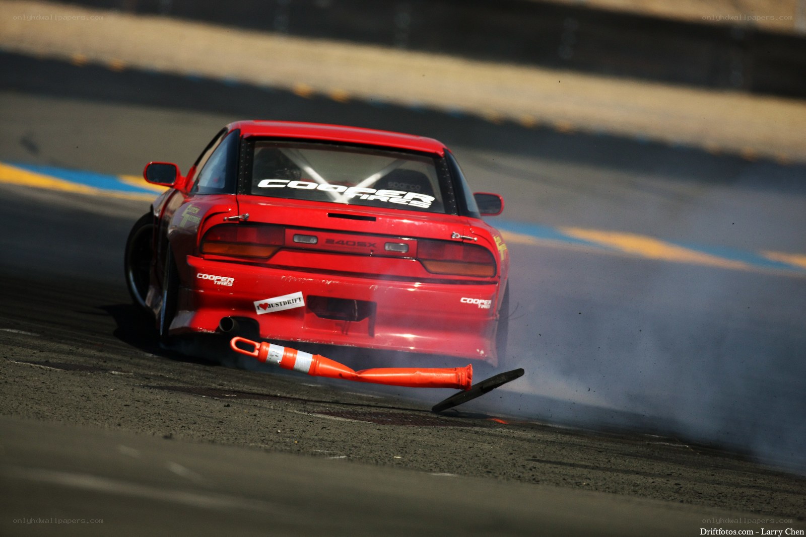 Red car drifting on track