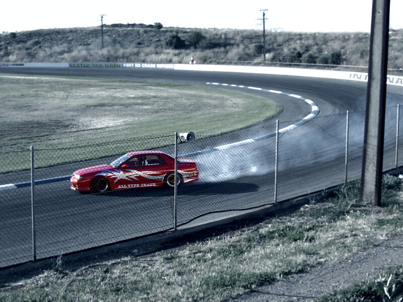 Red car drifting on track