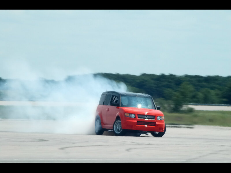 Red car drifting on track