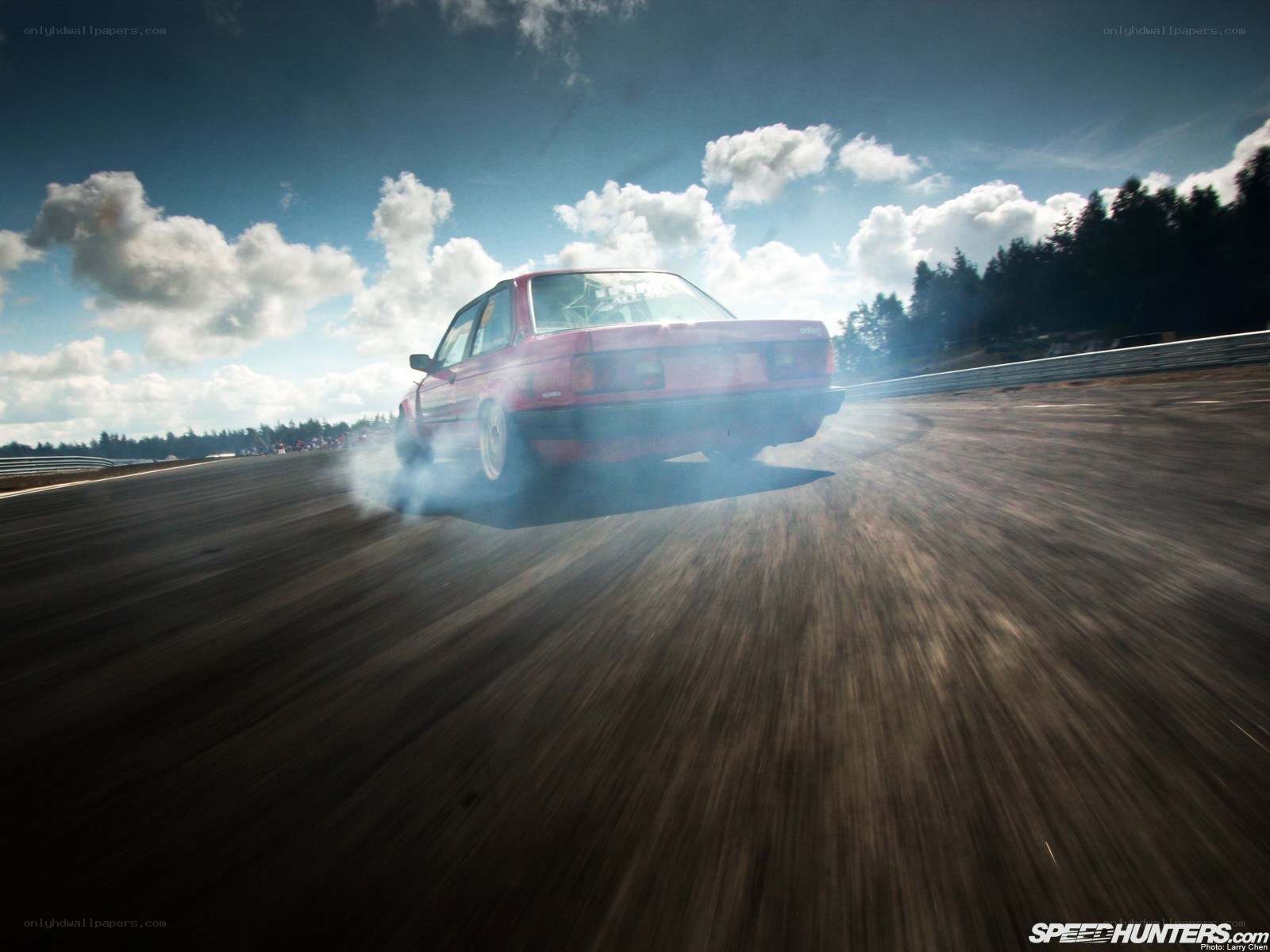 Red car drifting on track
