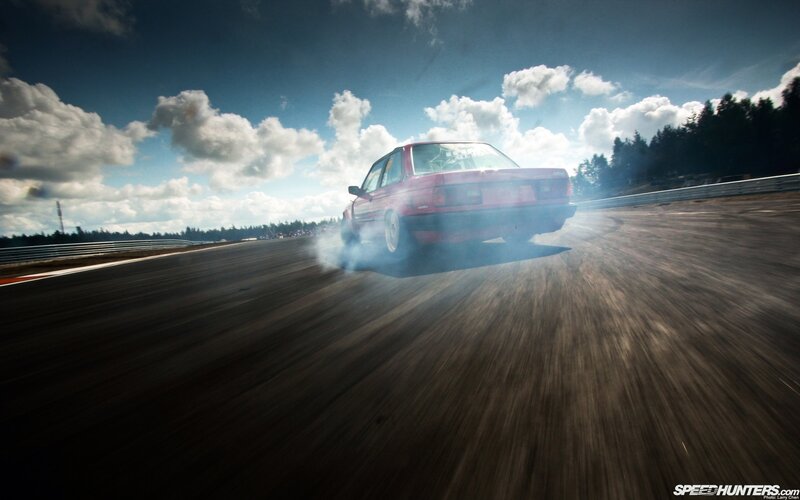 Red car drifting on track