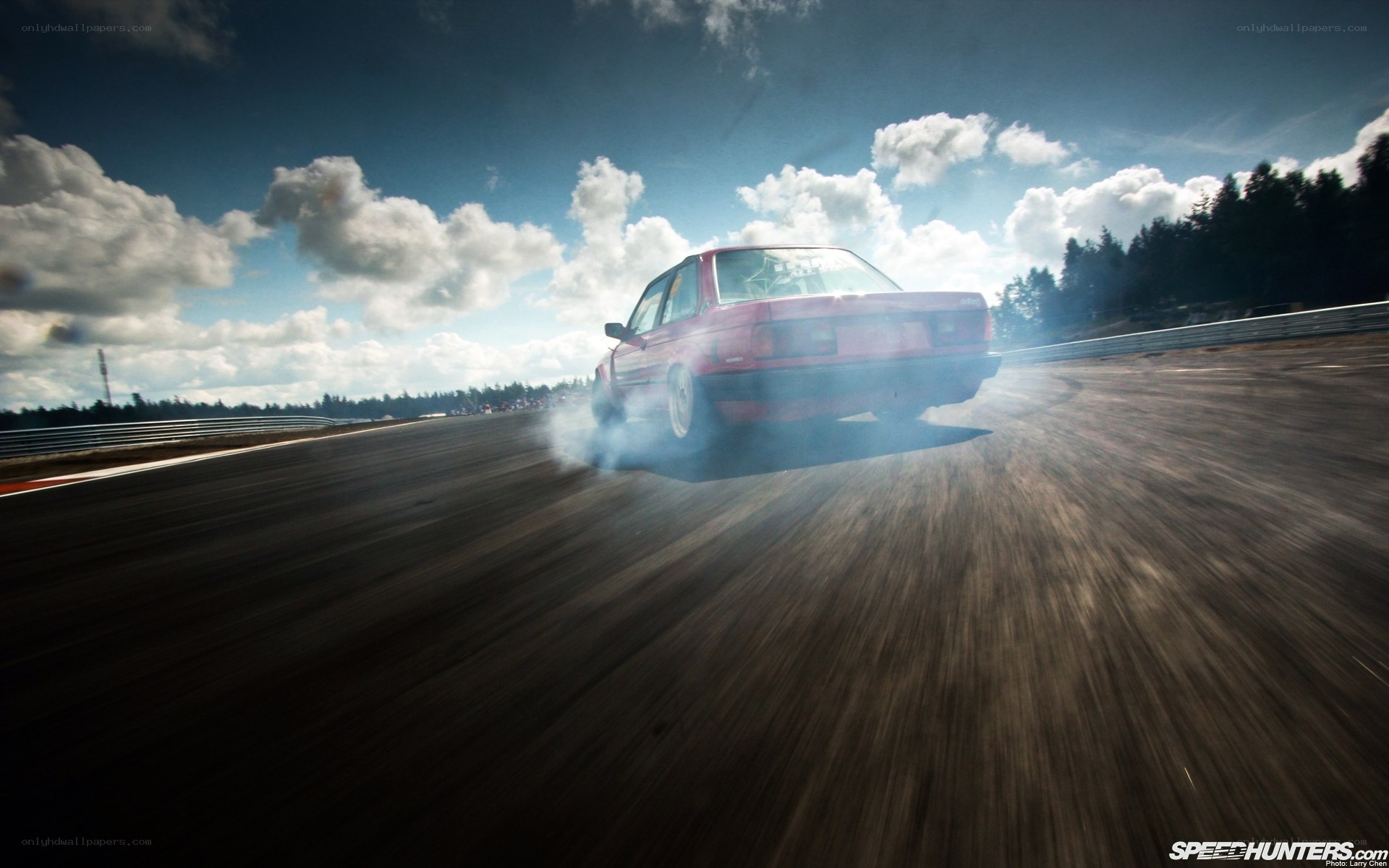 Red car drifting on track