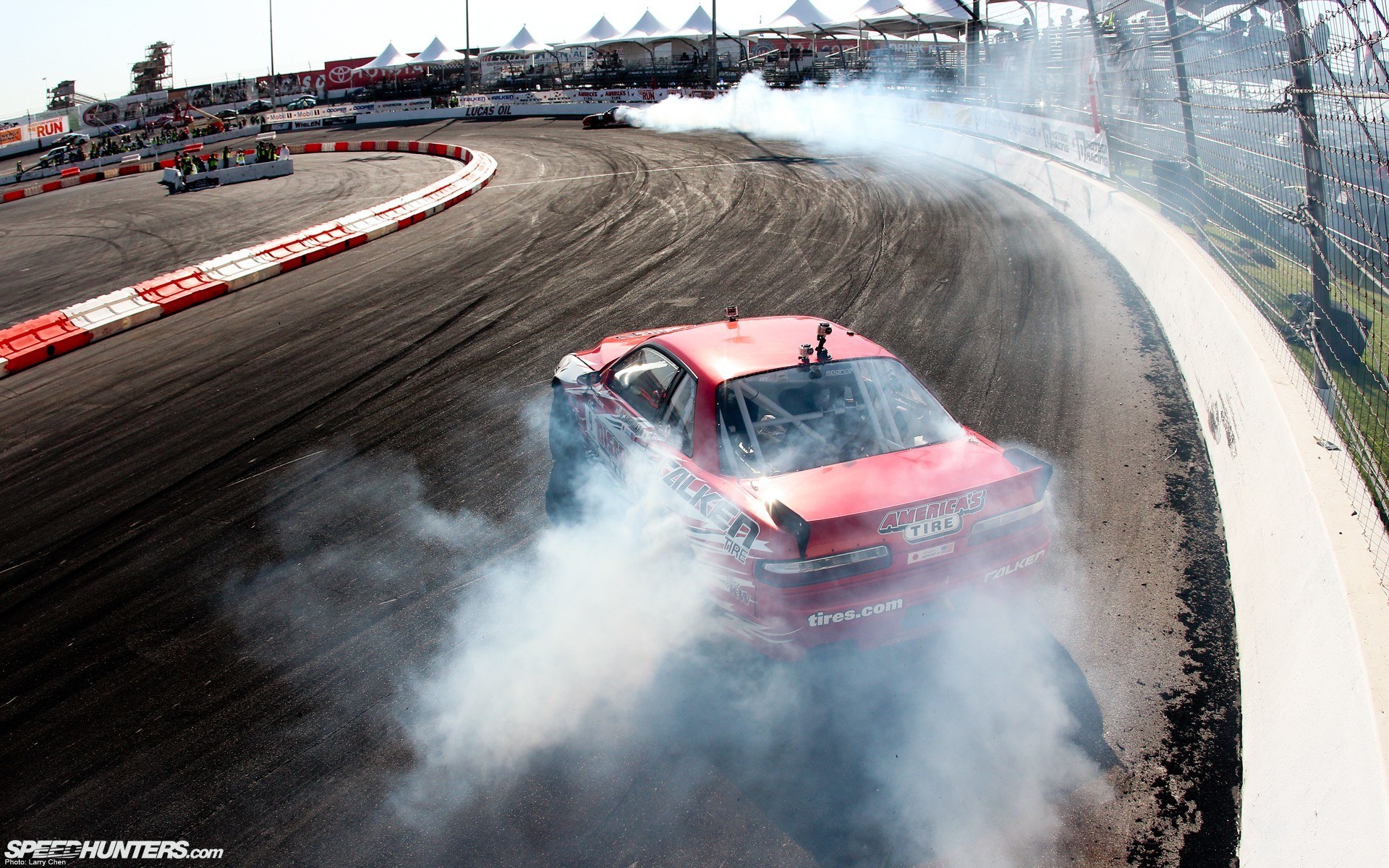 Red car drifting on track