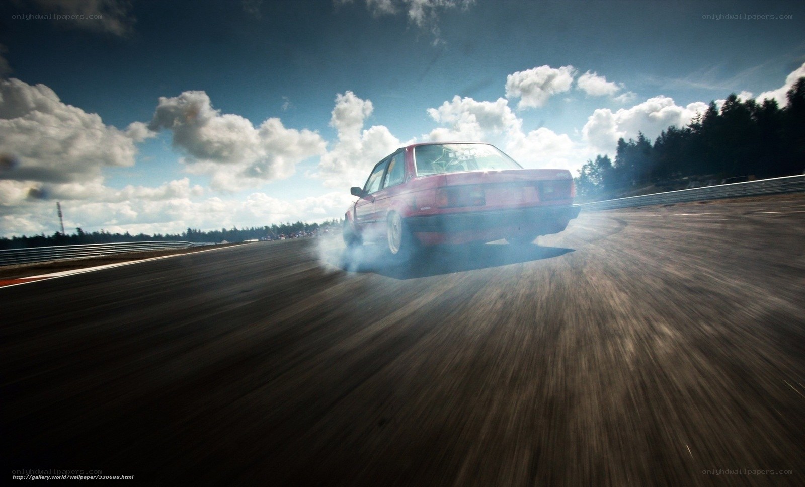 Red car drifting on track