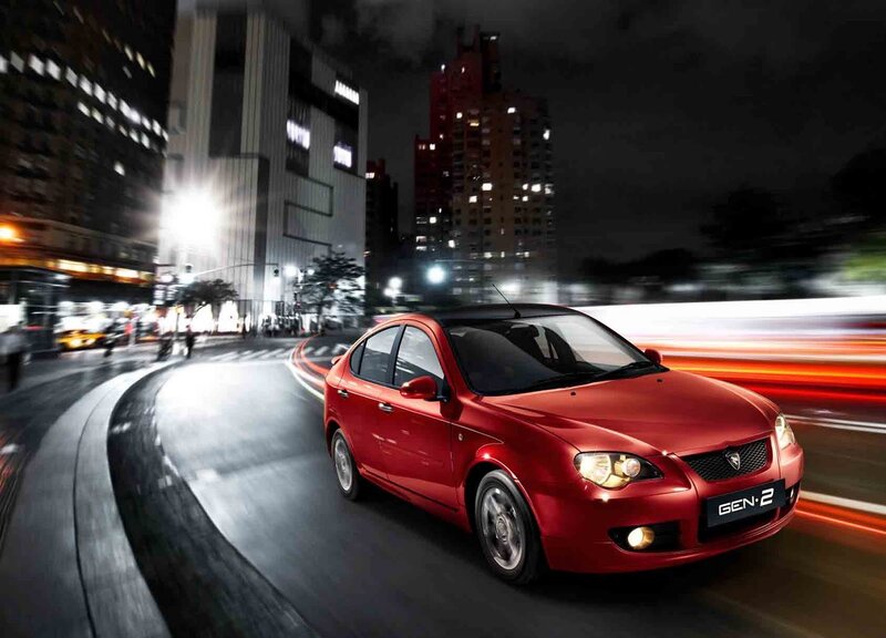Red car driving at night