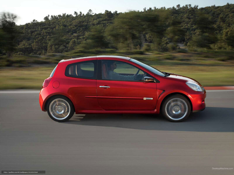 red car driving on road