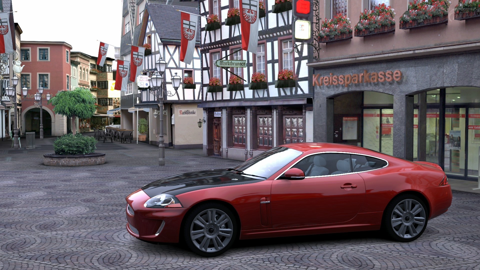 Red car in a town square