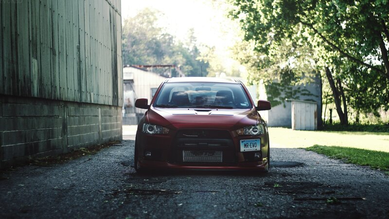 red car in alleyway