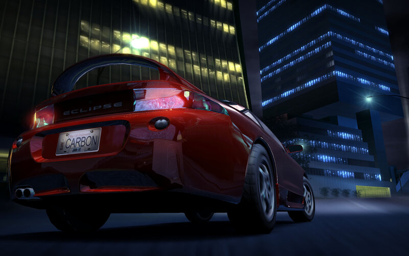 Red car in city at night