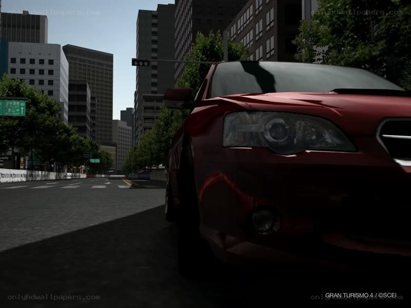 Red car in city street