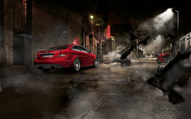 Red car in dark alley