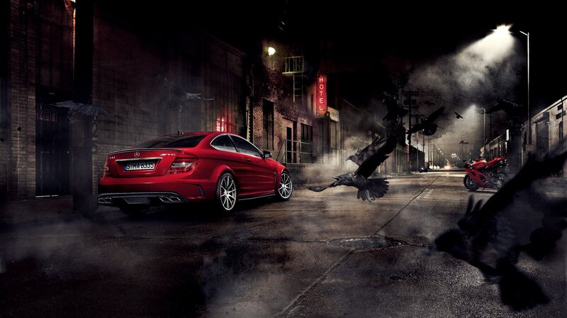 Red car in dark alley